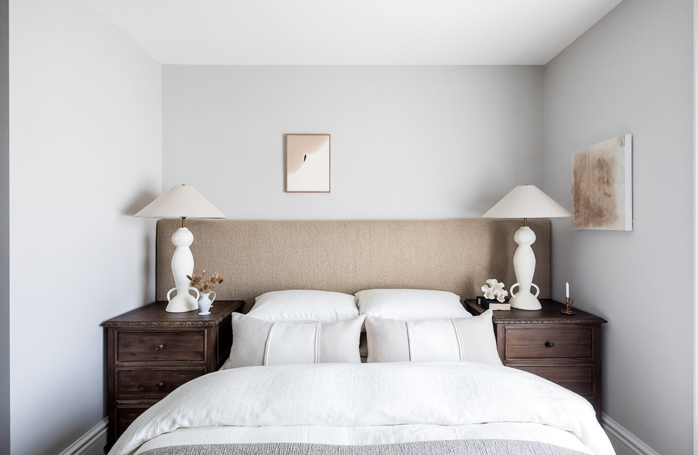 Apartment 06 bedroom with artwork and neutral palette