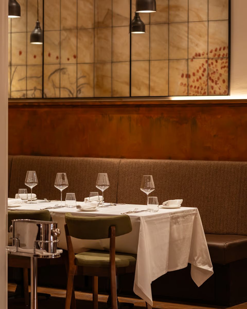 Origin City restaurant banquette and wall artwork detail