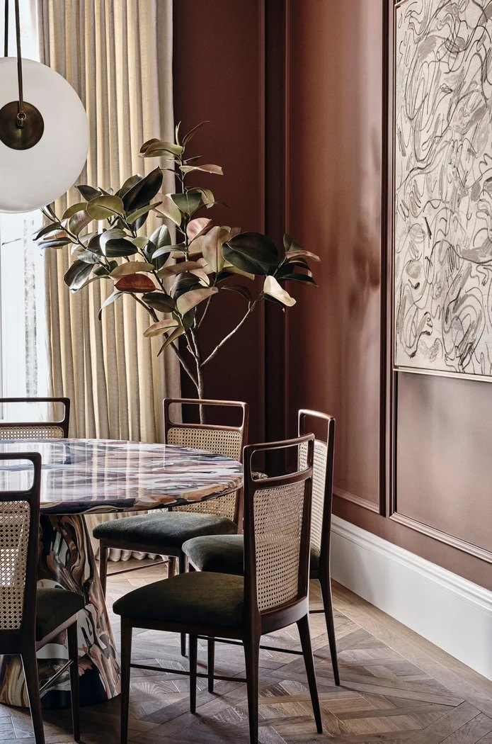Townhouse interior with artwork and composed dining setting