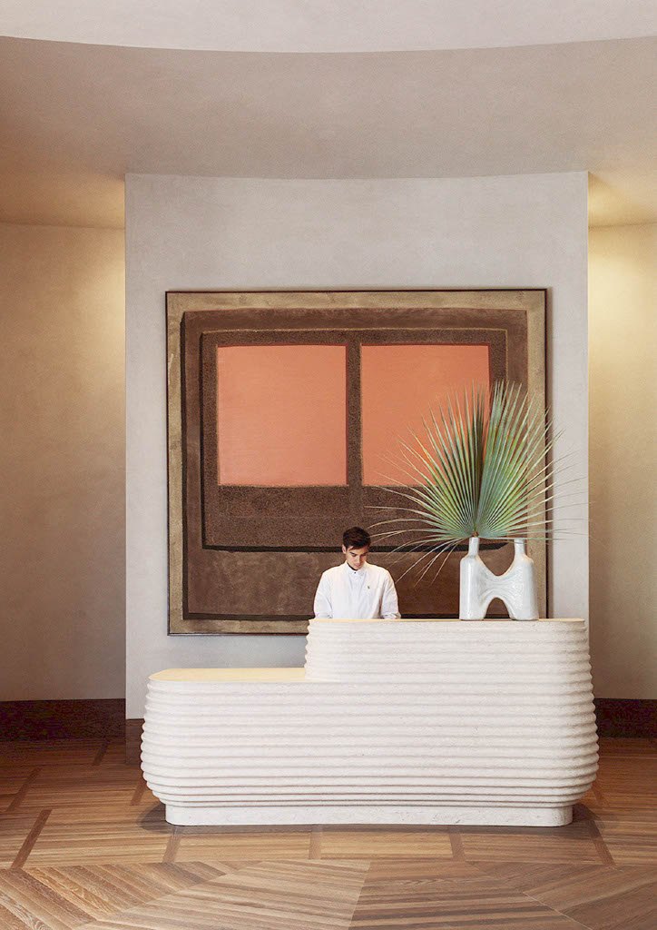 Warm hospitality interior detail with artwork and sculptural objects